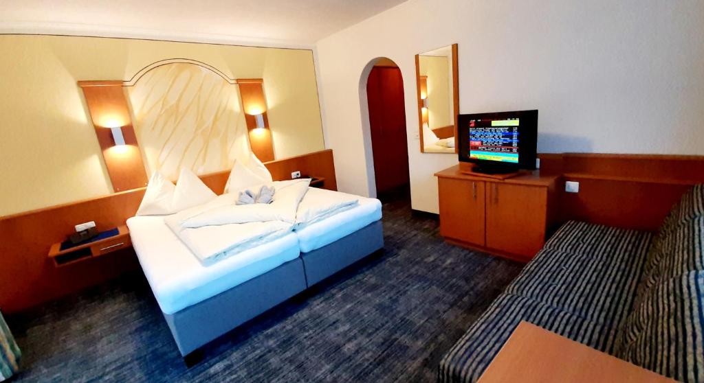 Postel nebo postele na pokoji v ubytování Soliva Hotel & Apartments