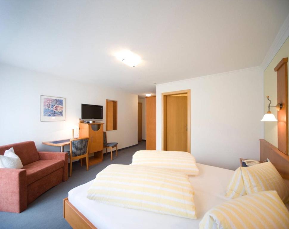 Postel nebo postele na pokoji v ubytování Soliva Hotel & Apartments