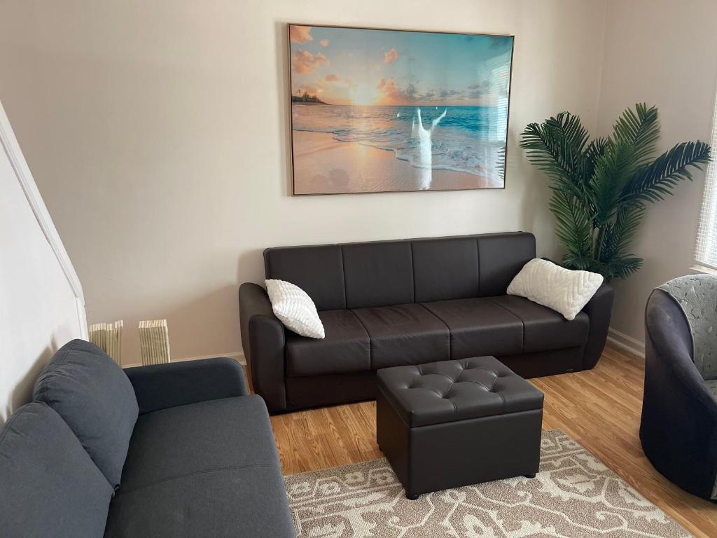 a living room with a couch and a chair at Kennedy House on Melrose Ave in Atlantic City