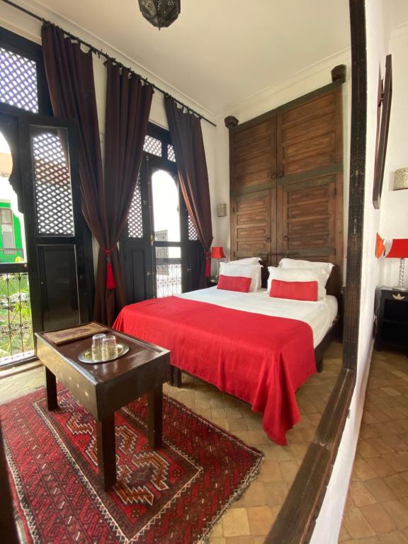 Postel nebo postele na pokoji v ubytování Riad Dar Balthazar