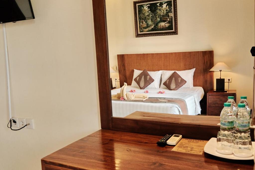 Postel nebo postele na pokoji v ubytování Sumantra Guest House