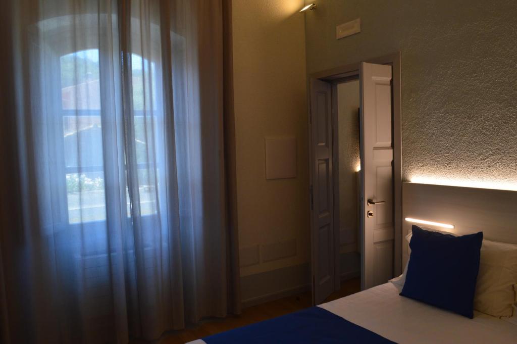 Postel nebo postele na pokoji v ubytování TANIT ROOMS & SPA