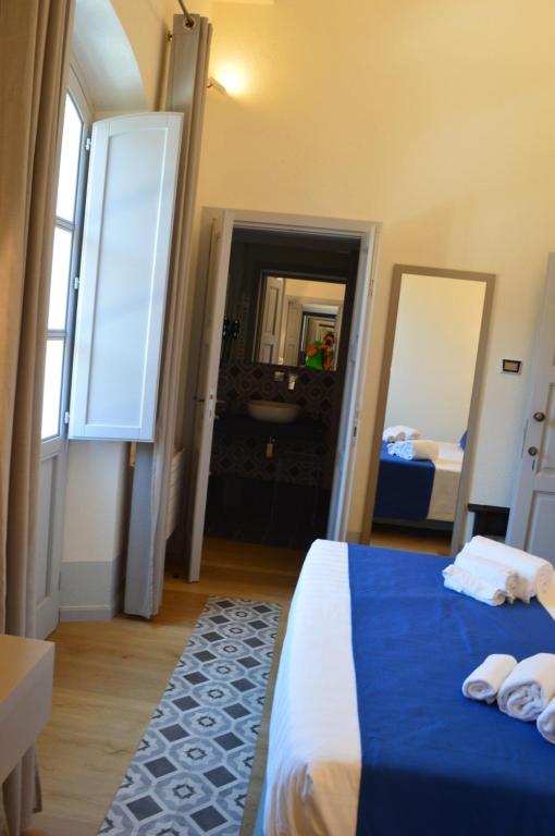 Postel nebo postele na pokoji v ubytování TANIT ROOMS & SPA