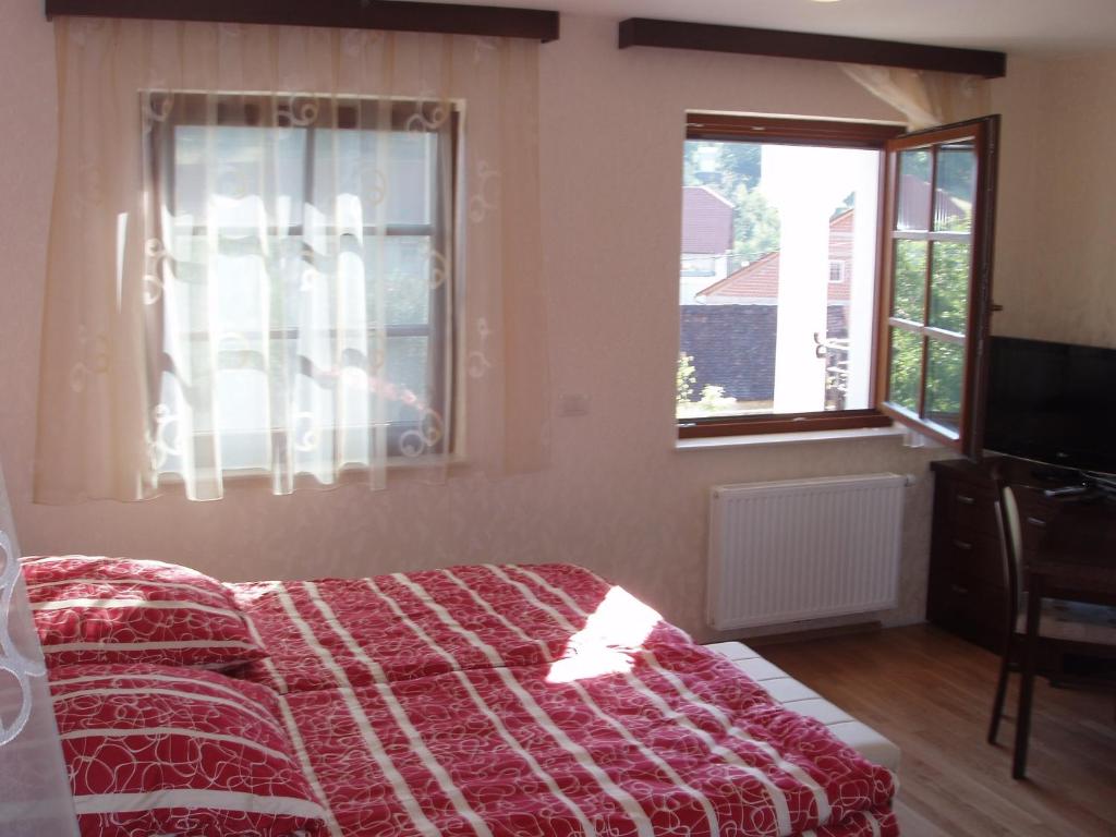Postel nebo postele na pokoji v ubytování Vila Silva Marija Apartments