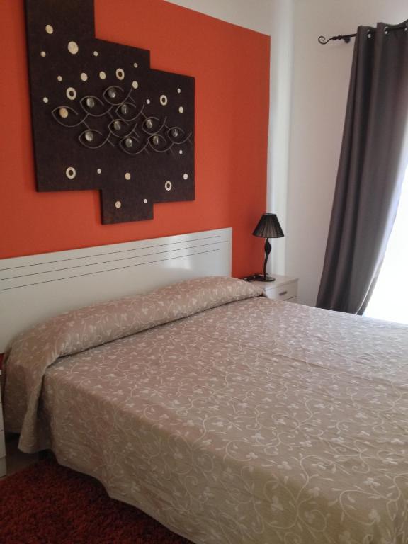 Postel nebo postele na pokoji v ubytování Orlando Apart