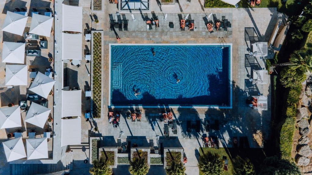 an overhead view of a large swimming pool at Grande Real Villa Itália Hotel & Spa in Cascais