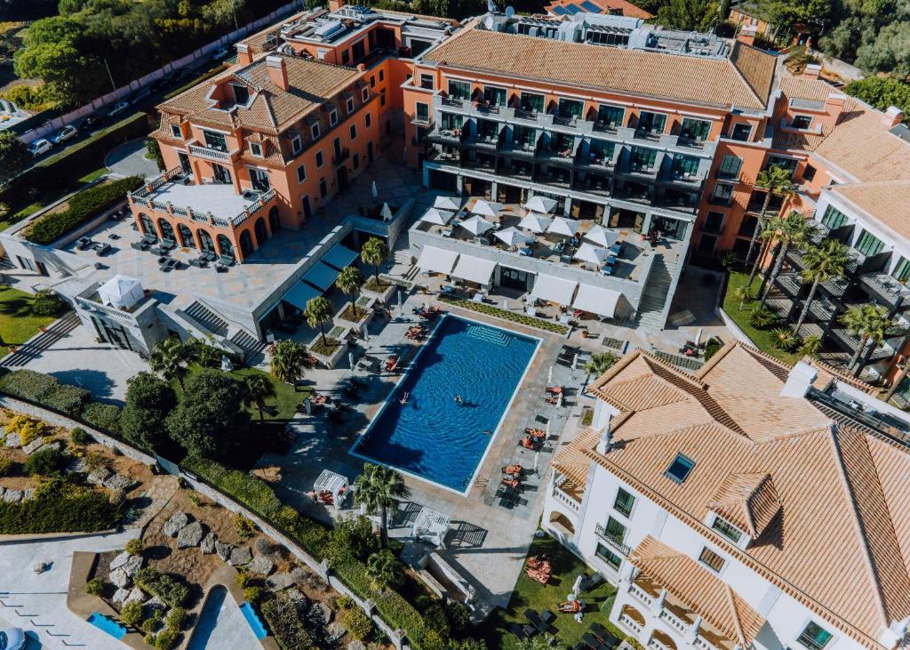 an aerial view of a mansion with a swimming pool at Grande Real Villa Itália Hotel & Spa in Cascais