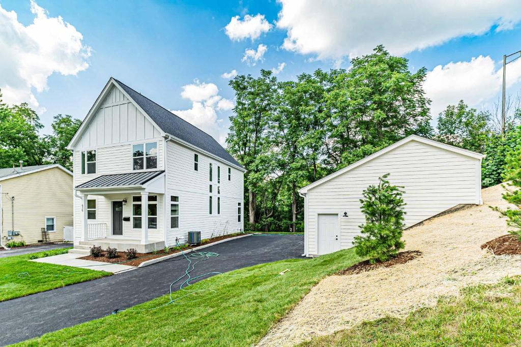 a white house with a garage at Brand new townhome in Downtown Naperville Family and Commute-friendly The May 3.5 in Naperville