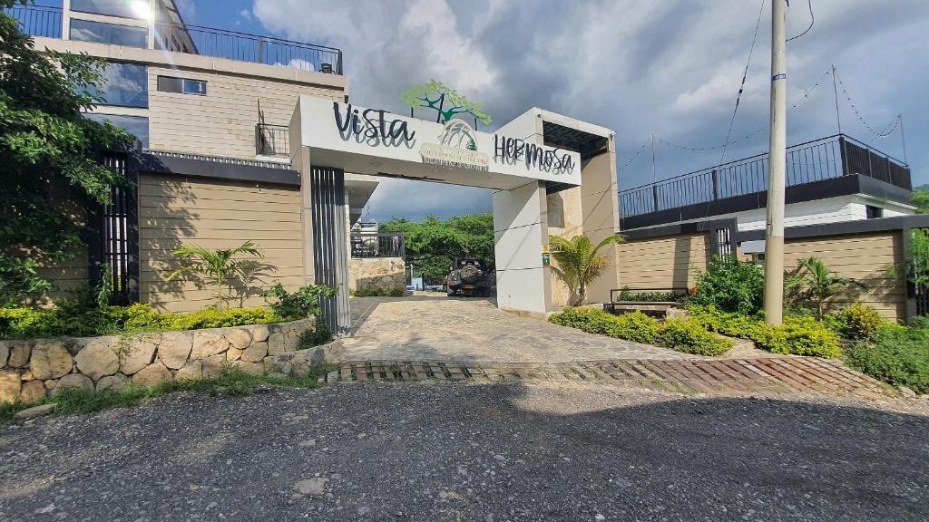 a building with a sign that reads west virginia hospital at Glamping romantico en Vista Hermosa disfruta de la naturaleza en un ambiente privado y acogedor in La Mesa