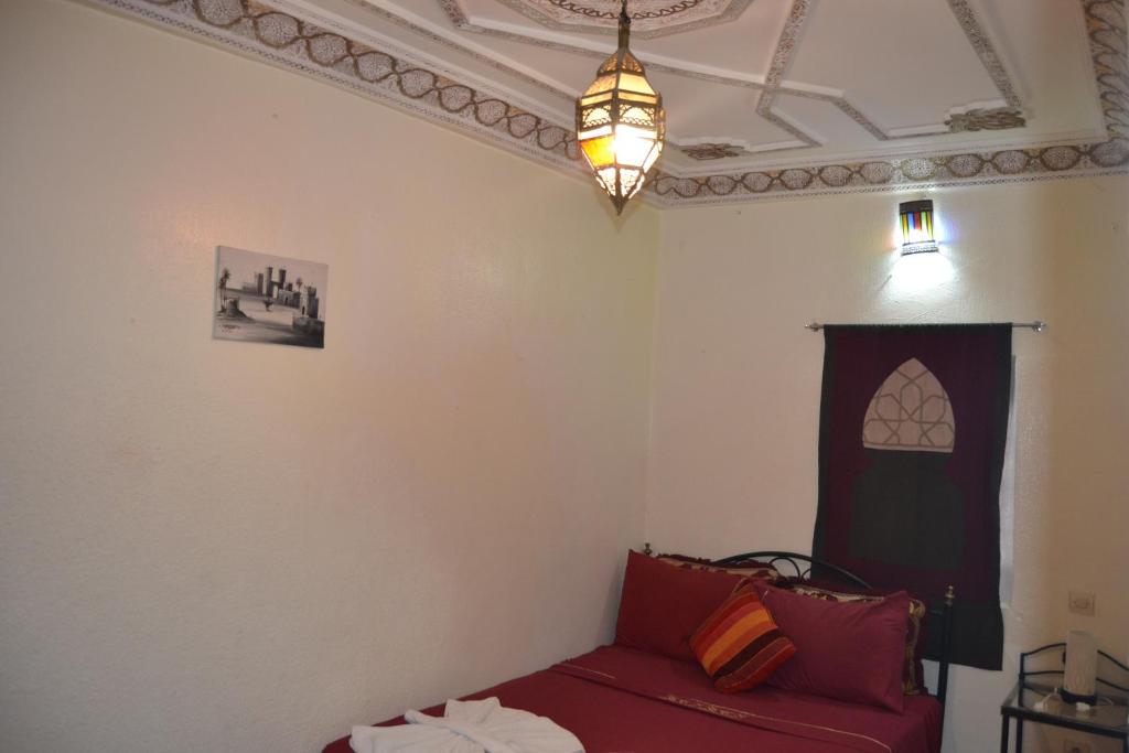 Postel nebo postele na pokoji v ubytování Riad el Boukhiri