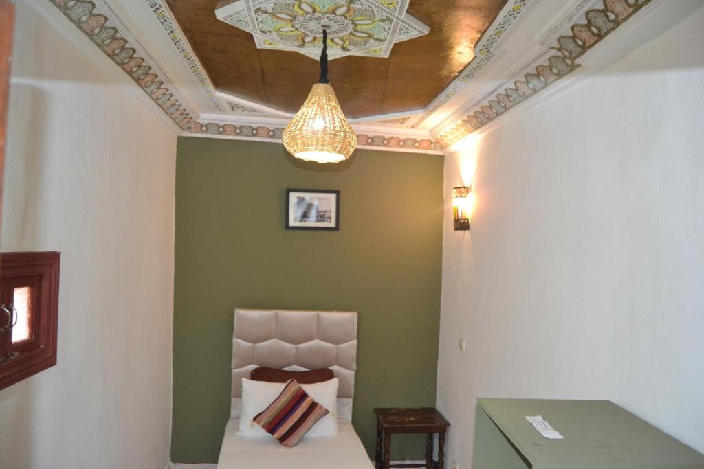 Postel nebo postele na pokoji v ubytování Riad el Boukhiri