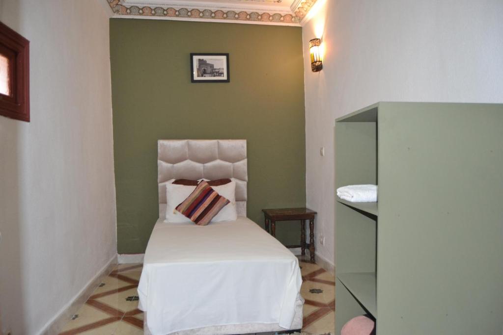 Postel nebo postele na pokoji v ubytování Riad el Boukhiri