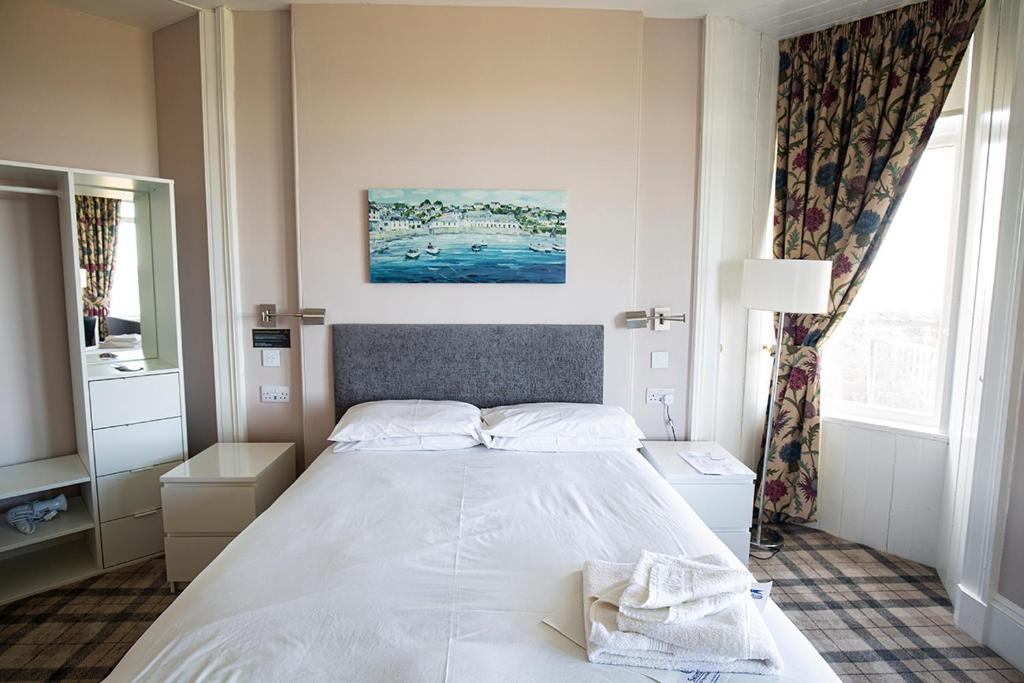 Postel nebo postele na pokoji v ubytování Poseidon Inn