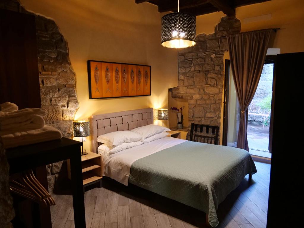Кровать или кровати в номере Al Cardinale