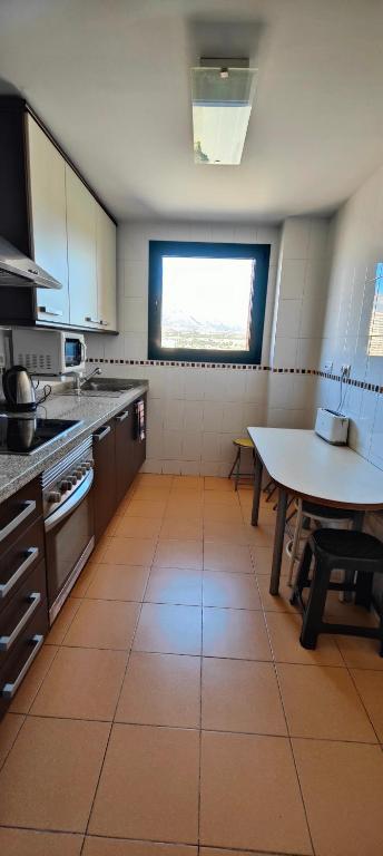 A kitchen or kitchenette at SOLO FAMILIAS TORRESOL