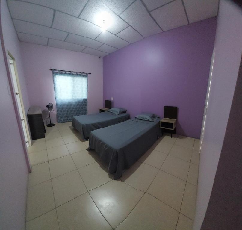 Postel nebo postele na pokoji v ubytování Villa de María