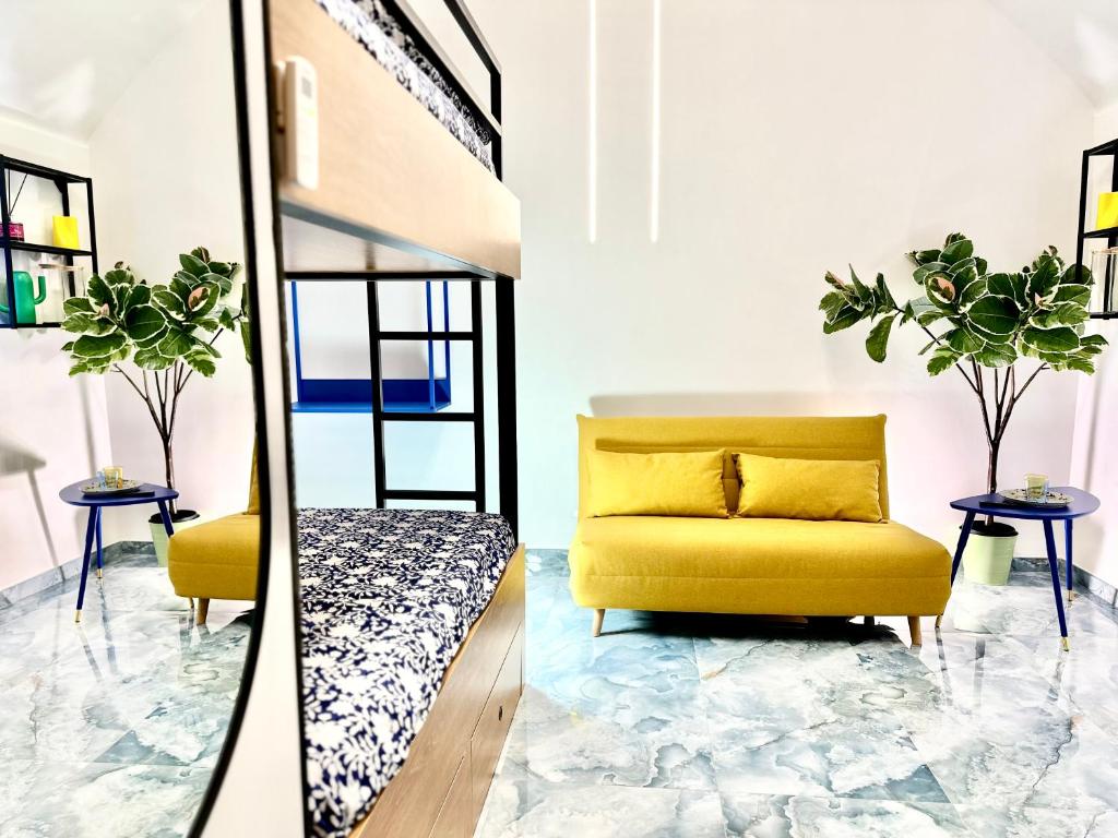 a living room with a yellow couch and a mirror at Linea1 Amalfi Coast 500 Mt Beach in Maiori