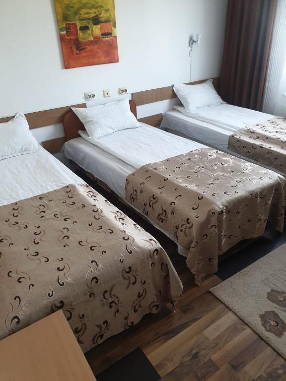 Postel nebo postele na pokoji v ubytování Hotel Mya