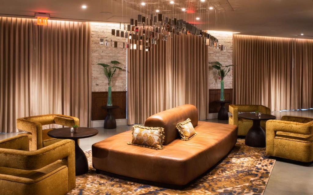 a lobby with a couch and two chairs and a table at Canopy by Hilton Washington DC Embassy Row in Washington, D.C.
