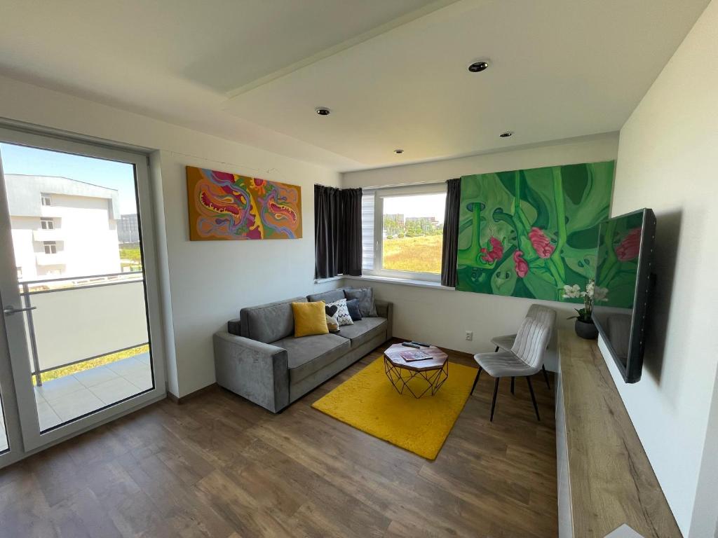 A television and/or entertainment centre at MK Apartment FREE Parking