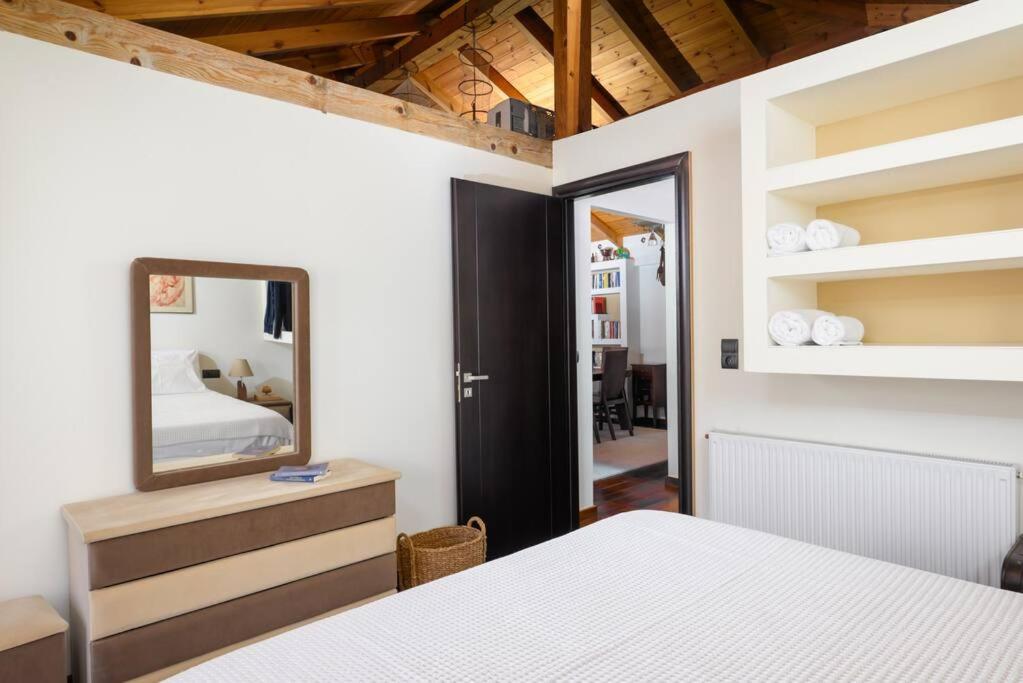 Postel nebo postele na pokoji v ubytování Archanes The Loft