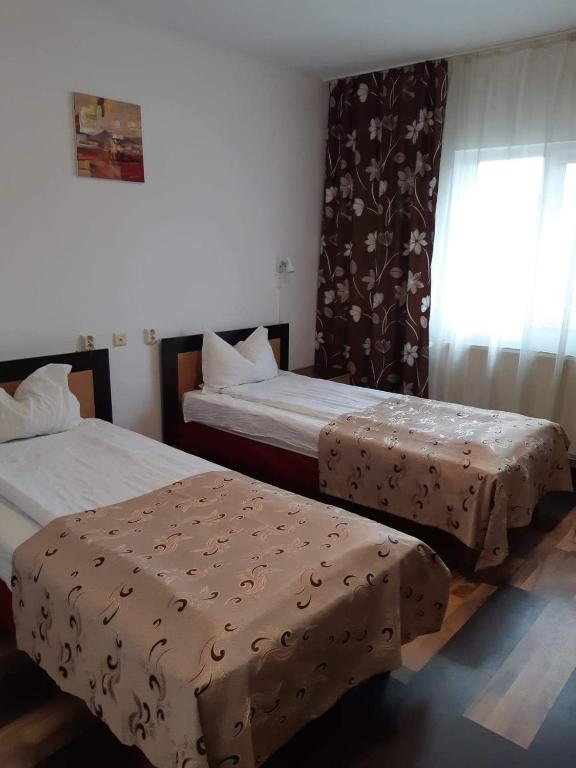 Postel nebo postele na pokoji v ubytování Hotel Mya