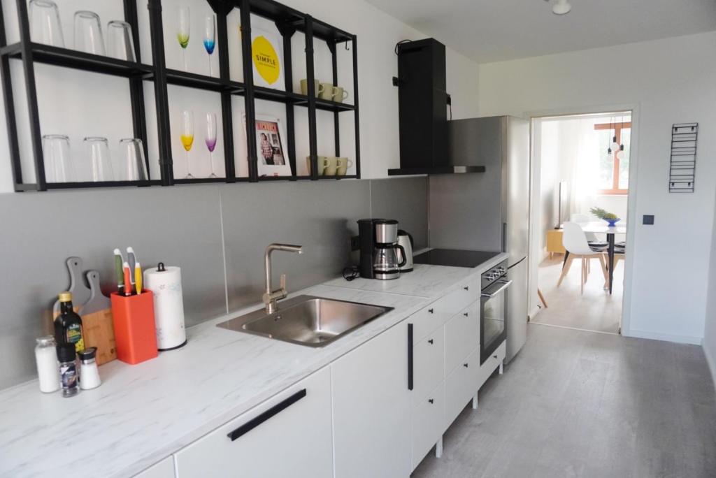 a kitchen with a sink and a counter top at Wohnen im alten Standesamt in Pasewalk