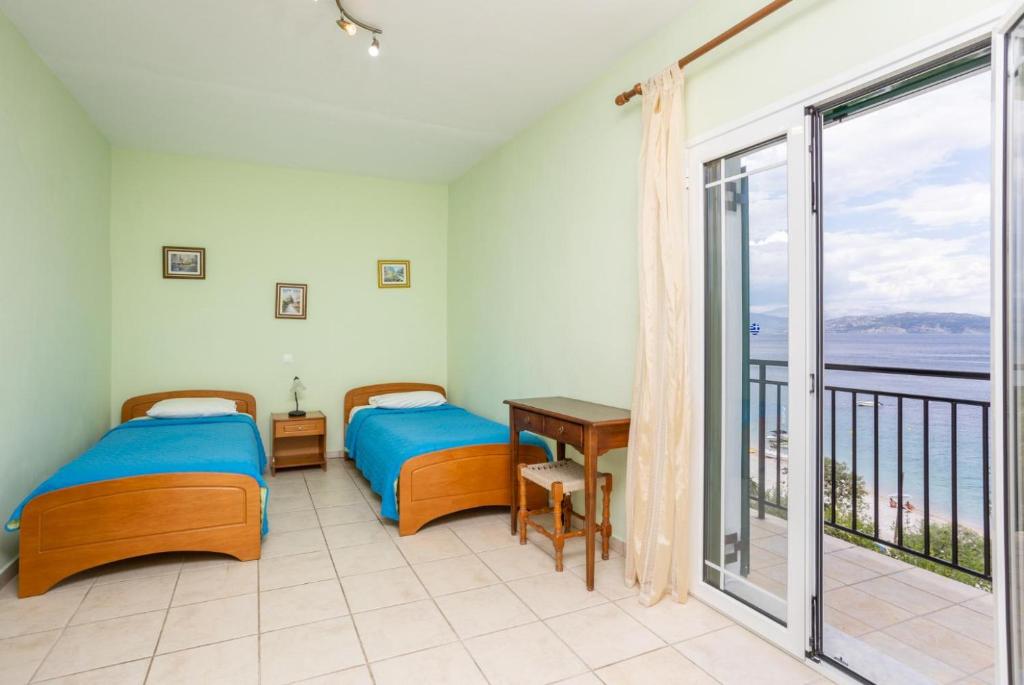 A bed or beds in a room at Villa Kerkyroula
