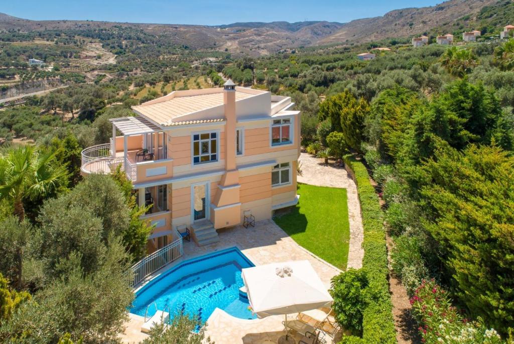 an aerial view of a villa with a swimming pool at Villa Pelagos in Agia Triada