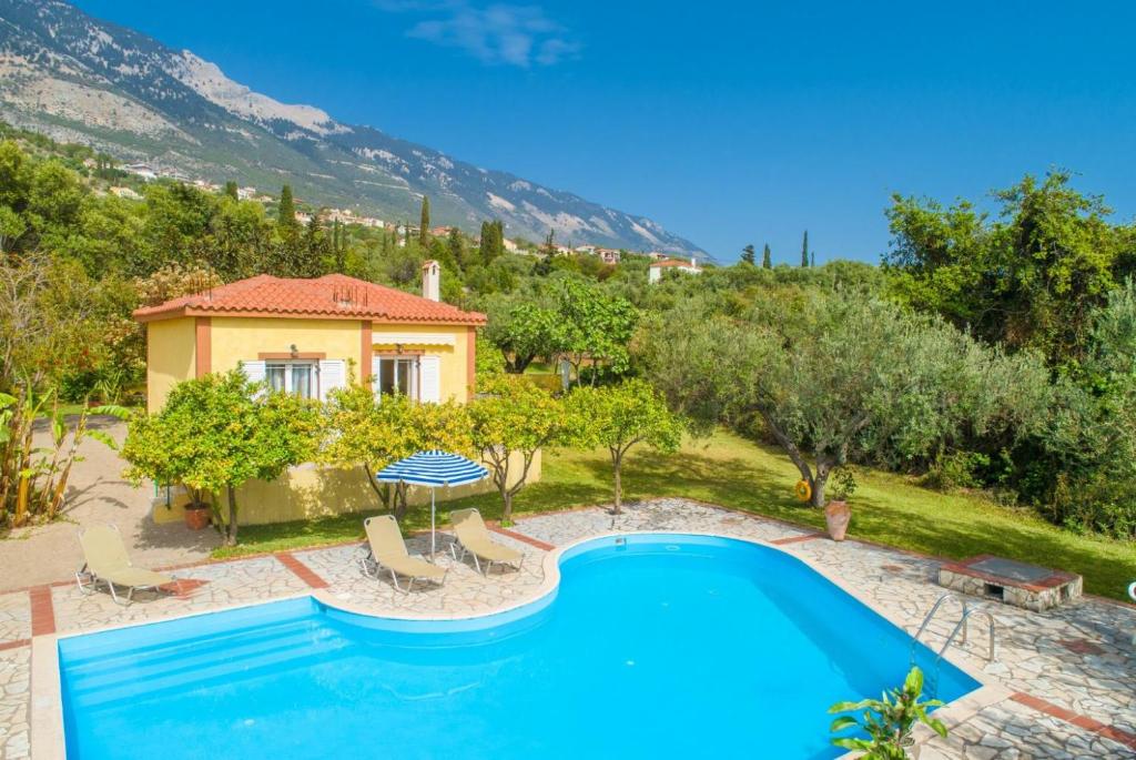 an image of a villa with a swimming pool at Villa Russa Dionisis in Trapezaki