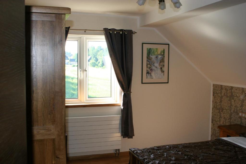 Postel nebo postele na pokoji v ubytování B&B Millenium House