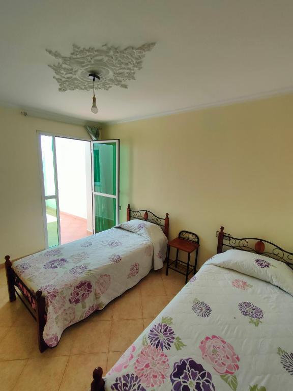 Letto o letti in una camera di La Luna Rentals