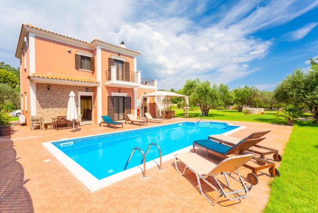 an image of a villa with a swimming pool at Villa Marina in Svoronata