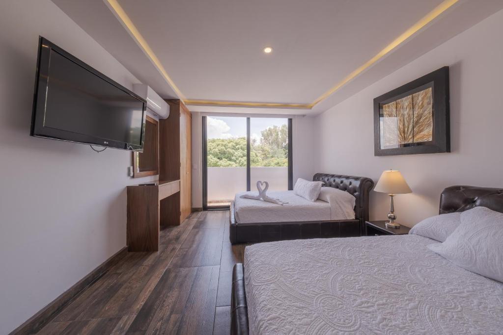 Postel nebo postele na pokoji v ubytování Nimue Marina Residence