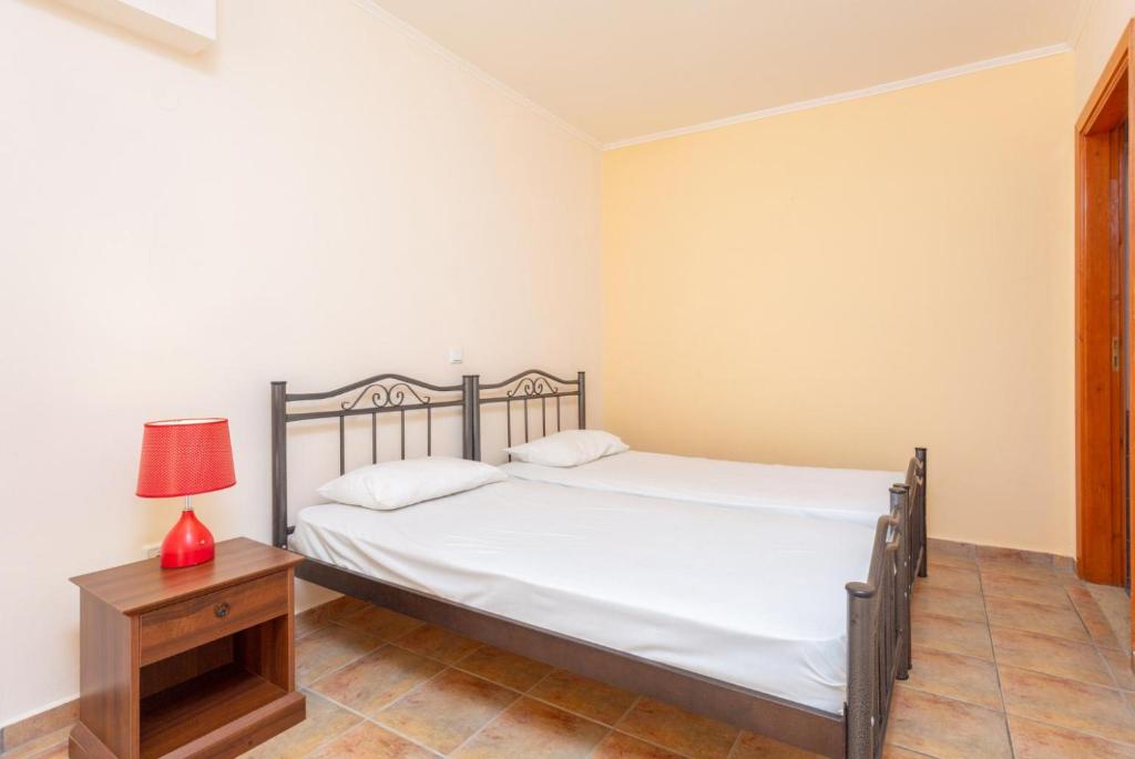 Postel nebo postele na pokoji v ubytování Villa Asimenia