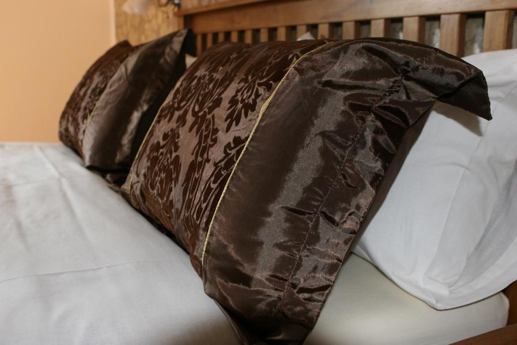 Postel nebo postele na pokoji v ubytování B&B Millenium House