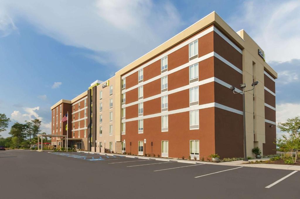 a rendering of the exterior of a building at Home2 Suites by Hilton Biloxi/North/D'Iberville in Biloxi