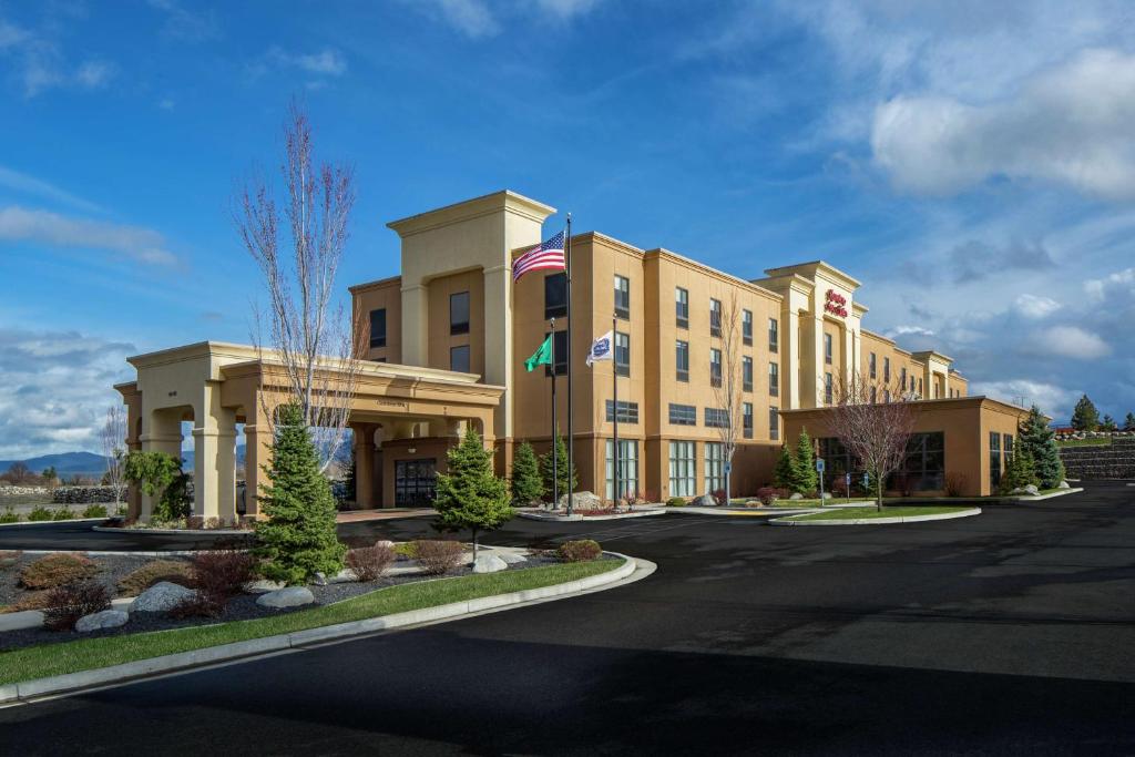 a rendering of a hotel with a building at Hampton Inn & Suites Spokane Valley in Spokane Valley