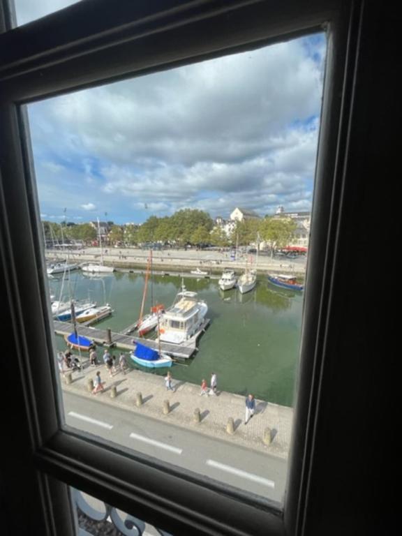 a view of a marina from a window at Bright apartment near the heart of Vannes in Vannes