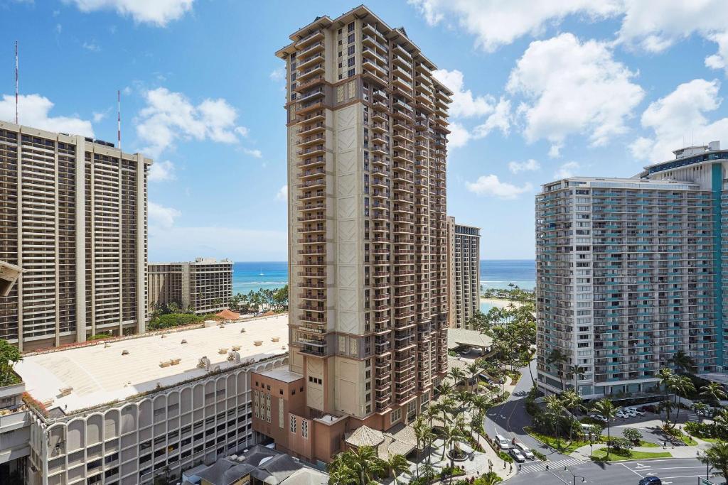an aerial view of a tall building in a city at Hilton Grand Vacations Club Grand Waikikian Honolulu in Honolulu