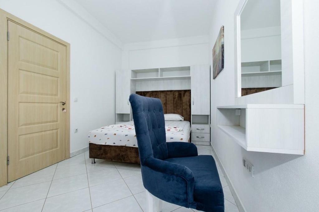 Postel nebo postele na pokoji v ubytování Flori Apartments