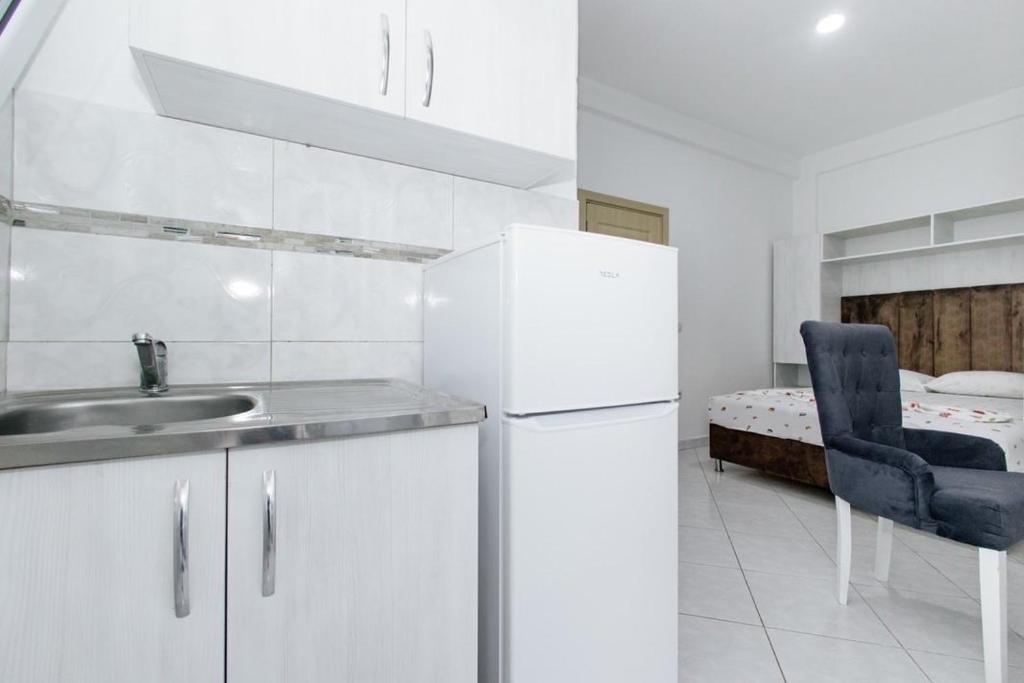 Kuchyň nebo kuchyňský kout v ubytování Flori Apartments