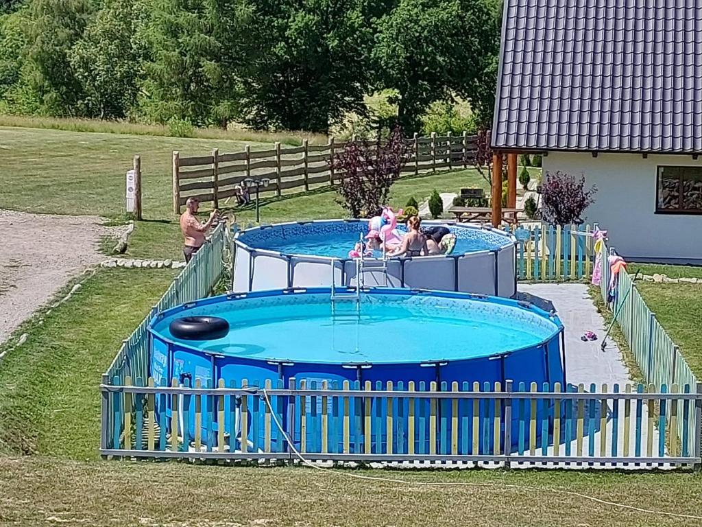 a group of people playing in a water park at Osada Solina in Solina