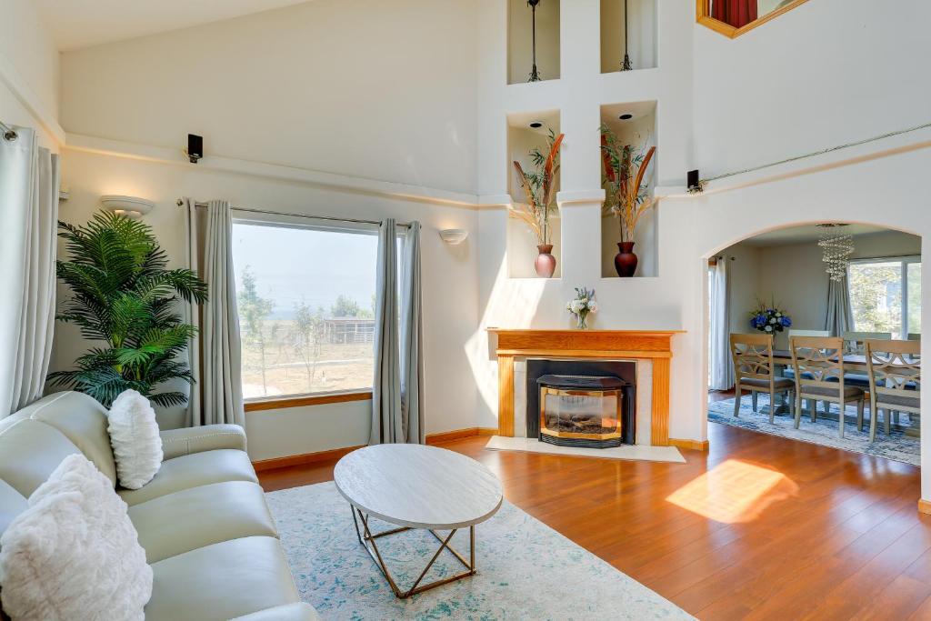 a living room with a couch and a fireplace at Seaside Eureka Vacation Rental with Bay Views! in Eureka