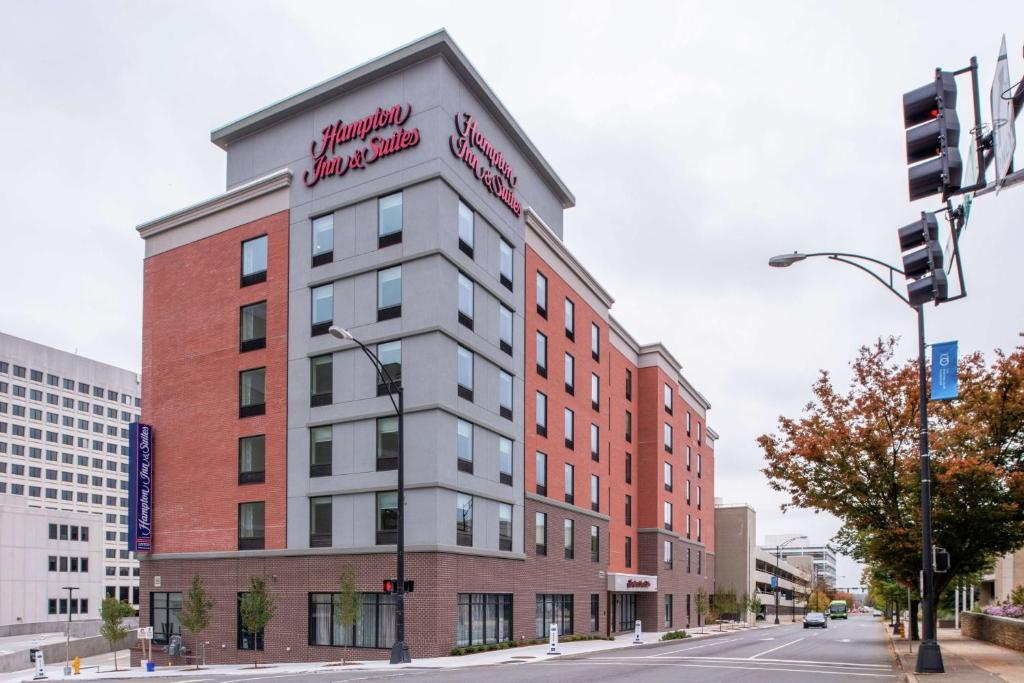 a building on a city street with a traffic light at Hampton Inn & Suites Winston-Salem Downtown in Winston-Salem