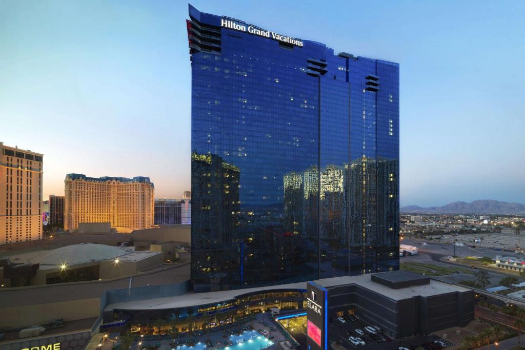 a view of a large blue building in a city at Hilton Grand Vacations Club Elara Center Strip Las Vegas in Las Vegas
