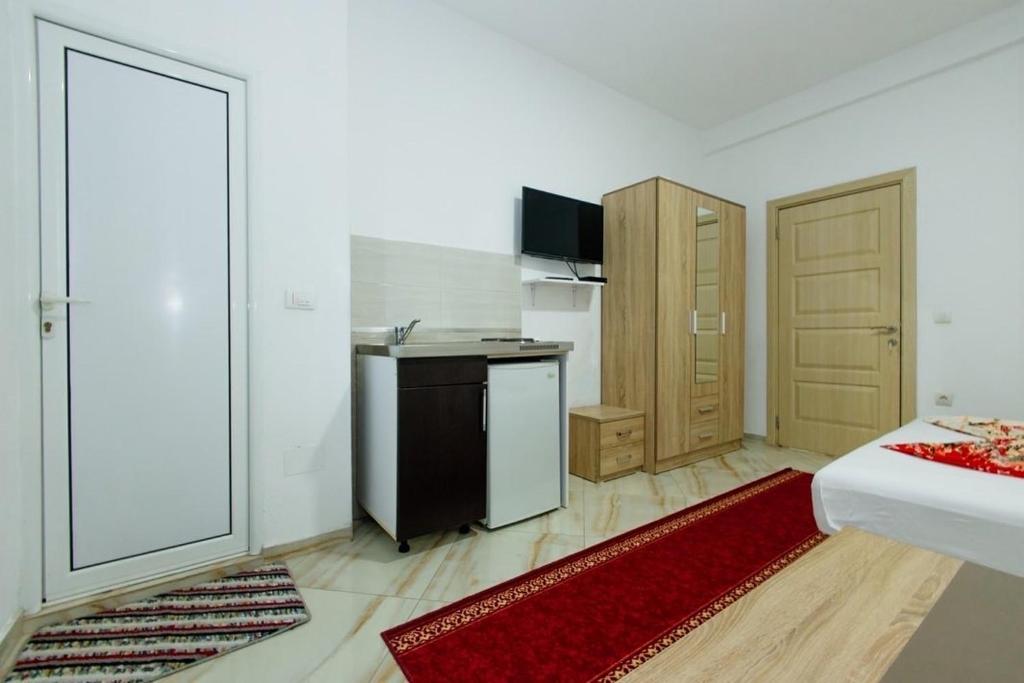 TV a/nebo společenská místnost v ubytování Flori Apartments