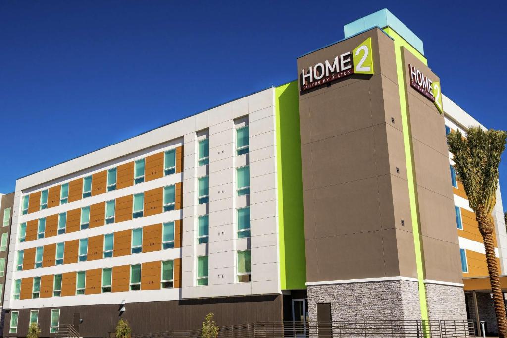 a hotel building with a sign that reads home at Home2 Suites by Hilton Las Vegas Stadium District in Las Vegas