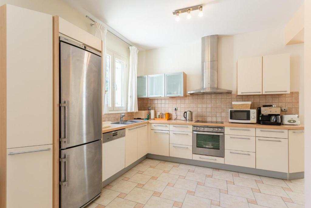 A kitchen or kitchenette at Katelios Villas Collection