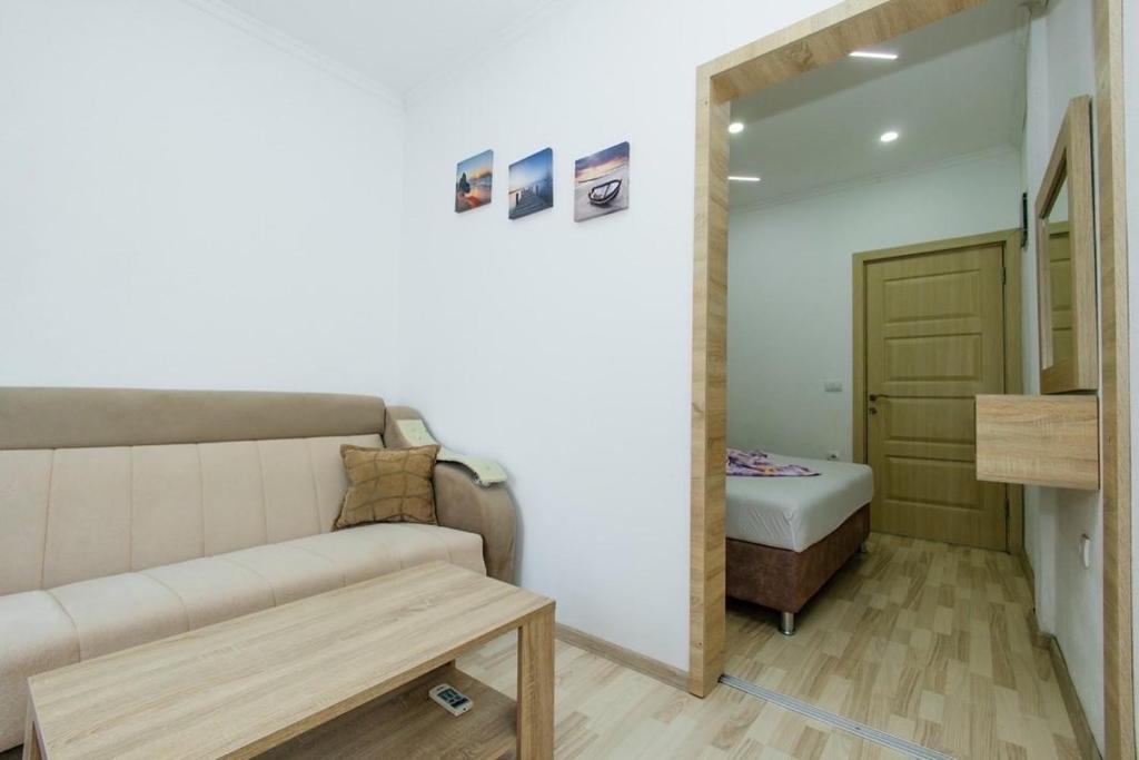 Postel nebo postele na pokoji v ubytování Flori Apartments